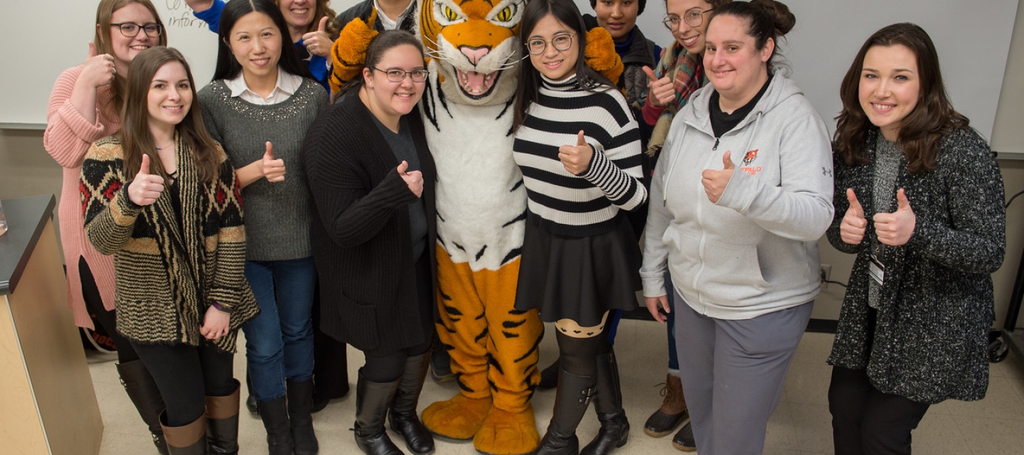 Students and faculty with Benji the mascot